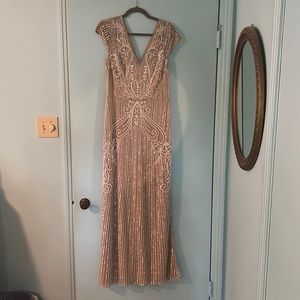 Beautiful beige/nude colored gown size 10! Only worn once and in perfect shape!